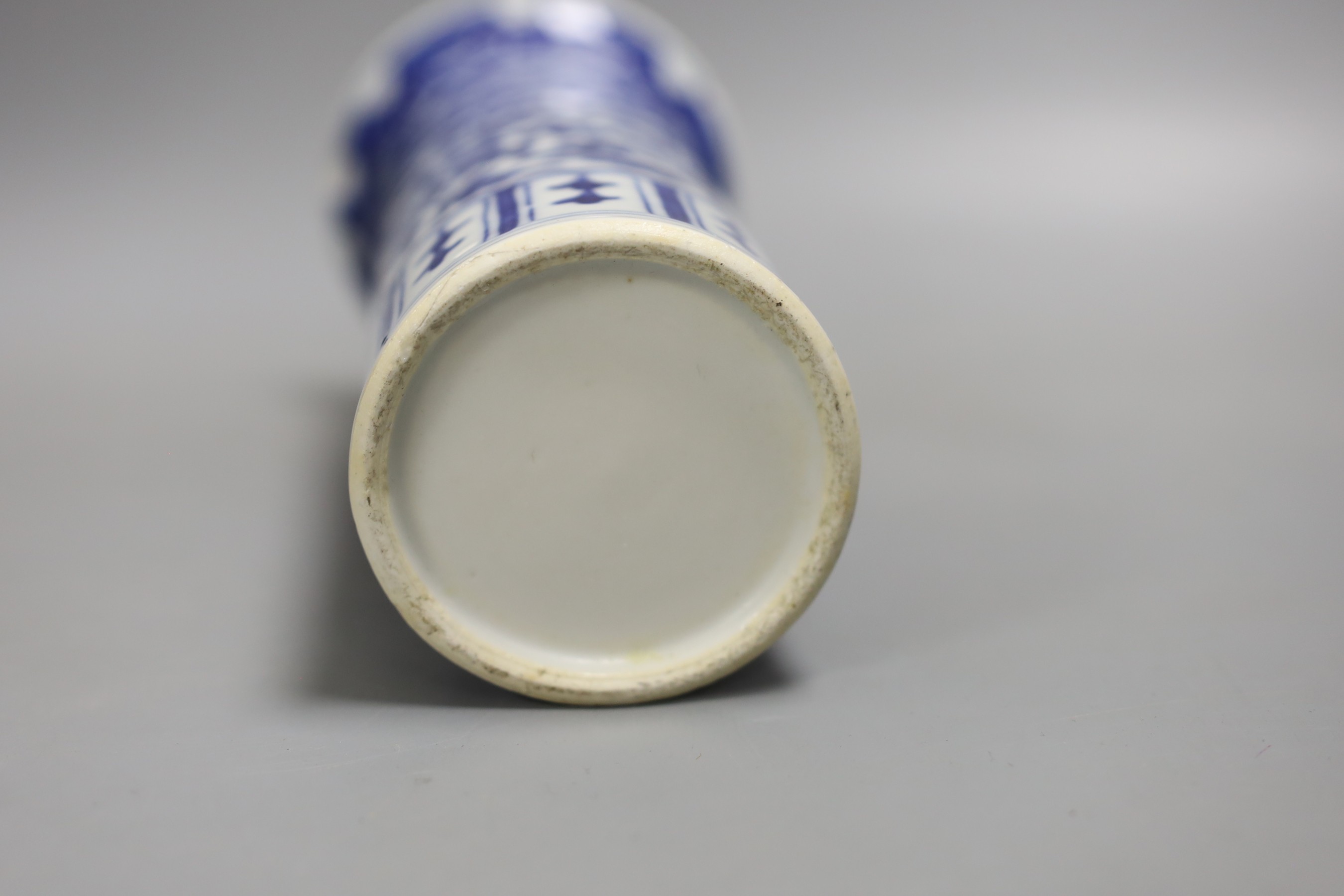 A 19th century Chinese blue and white ‘landscape’ vase, an early 20th century blue and white sleeve vase and three blue and white jars and covers. Tallest 25.5cm